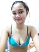 Cute tall Asian teen exposes her tits and pussy