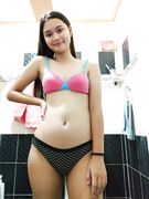 Cute tall Asian teen exposes her tits and pussy