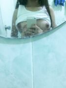 Cute heart between Asian teen boobs