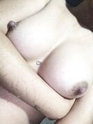 Cute heart between Asian teen boobs