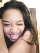 Nudes of amateur Asian babe with braces