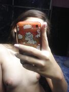 Asian teen exposing her pussy and small boobs