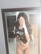 Sexy Asian chick licks her purple dildo