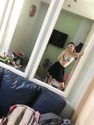 Hot slim Asian coed exposes her naked body to mirror