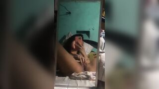 Asian teen girl fingers her pussy