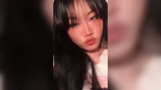 Asian babe touches her perfect naked boobies
